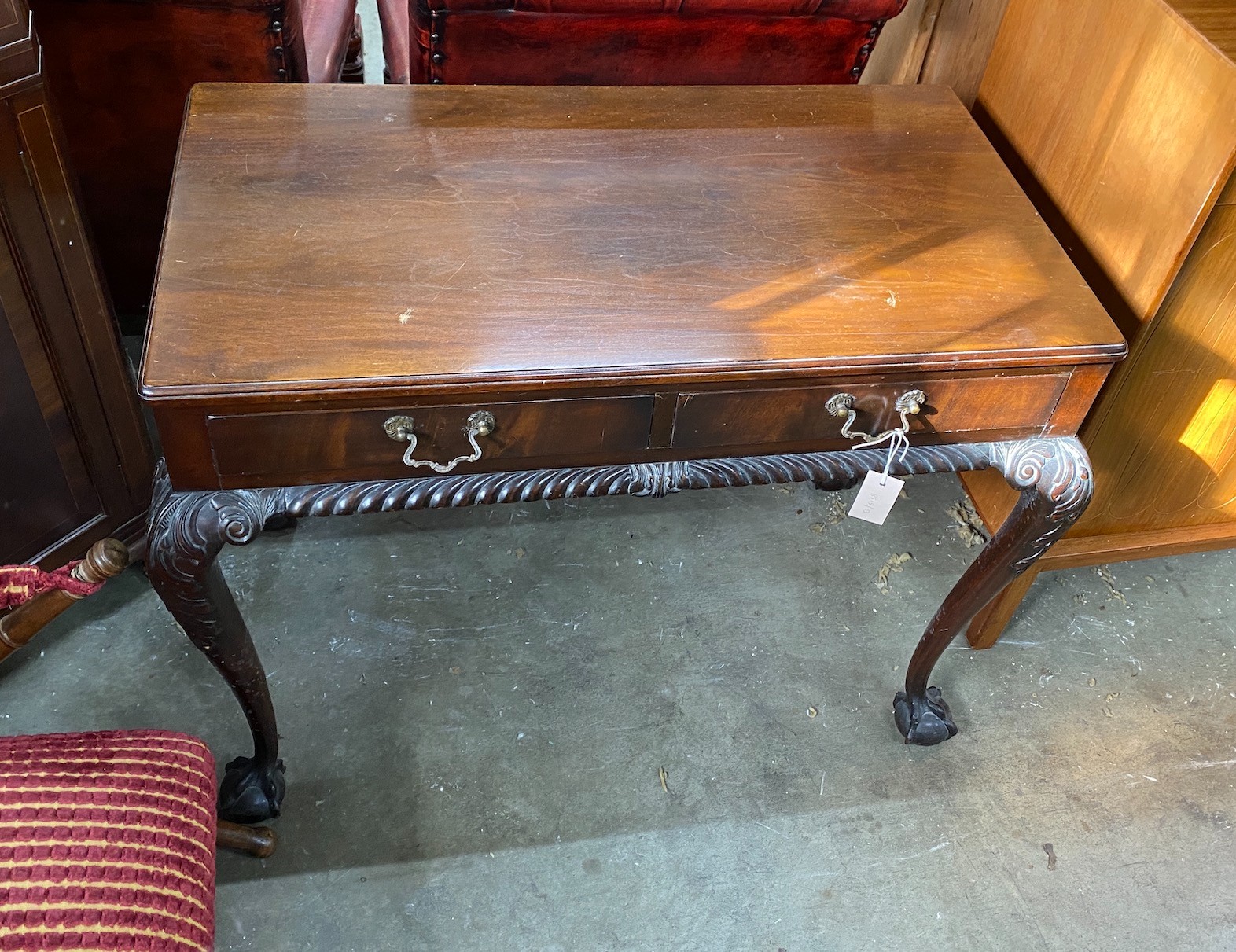 An early 20th century Chippendale revival mahogany two drawer side table, width 92cm, depth 52cm, height 71cm *Please note the sale commences at 9am.